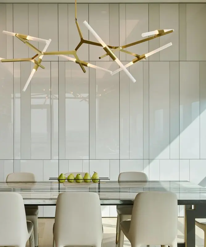 Dining room with a brass chandelier in warm afternoon light